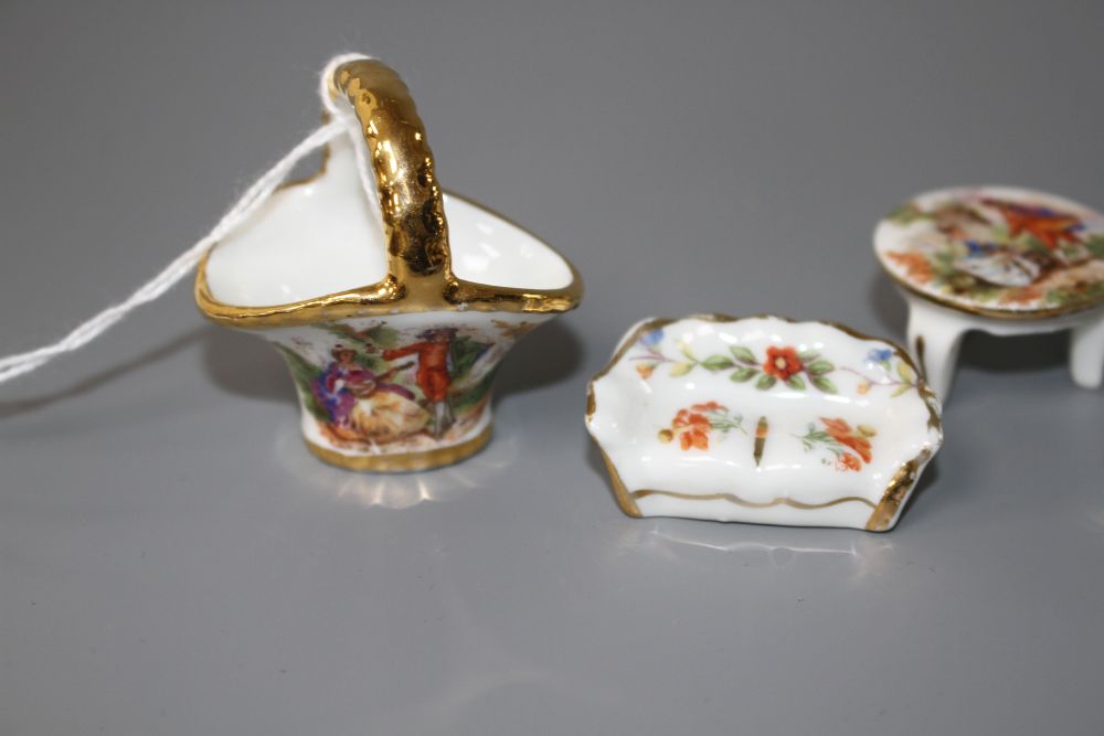 An eight piece Limoges porcelain miniature salon suite and a similar basket, 4.5cm